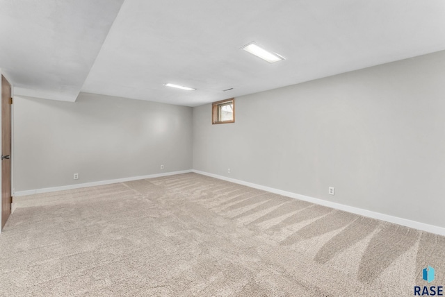 basement with baseboards and carpet floors