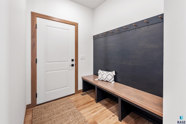 mudroom with baseboards and light wood finished floors