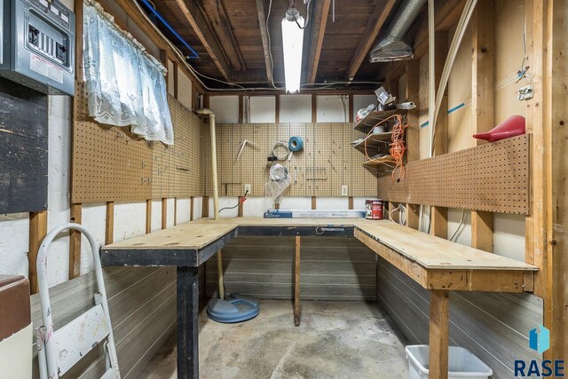 unfinished below grade area with a workshop area