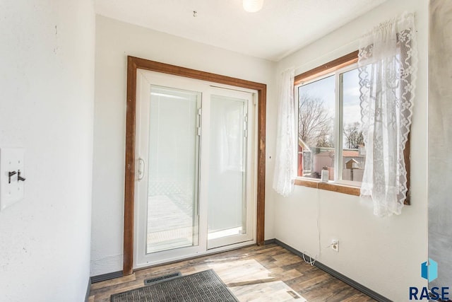 entryway with visible vents and wood finished floors