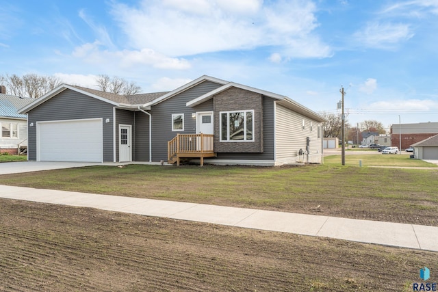 ranch-style home with an attached garage, driveway, and a front lawn
