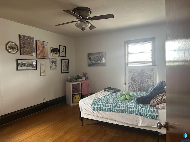 bedroom with wood finished floors and ceiling fan