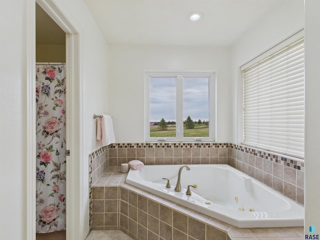 bathroom featuring a tub with jets