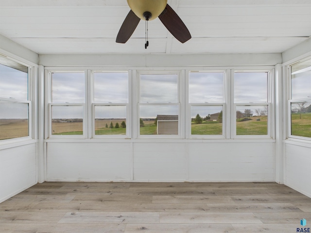 unfurnished sunroom featuring wood finished floors