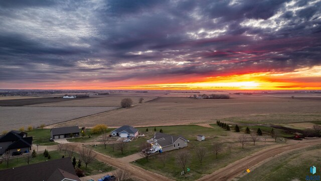 aerial view at dusk featuring a rural view