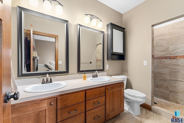 501 Taylor Dr, Tea, SD 57064 - bathroom featuring toilet, connected bathroom, double vanity, and a sink