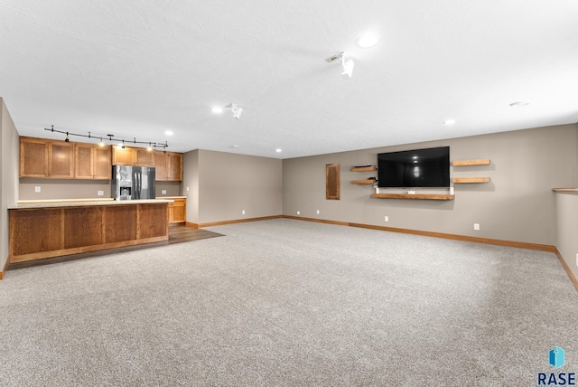 501 Taylor Dr, Tea, SD 57064 - unfurnished living room featuring recessed lighting, track lighting, light colored carpet, and baseboards