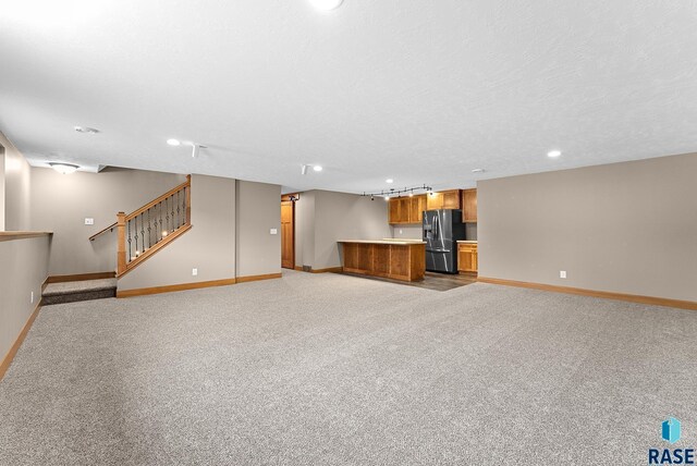 501 Taylor Dr, Tea, SD 57064 - unfurnished living room with baseboards, recessed lighting, light colored carpet, and indoor wet bar