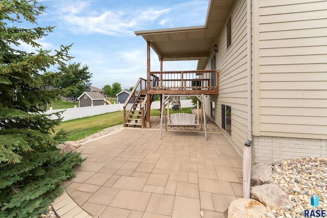 501 Taylor Dr, Tea, SD 57064 - view of patio / terrace featuring a wooden deck, stairway, and fence