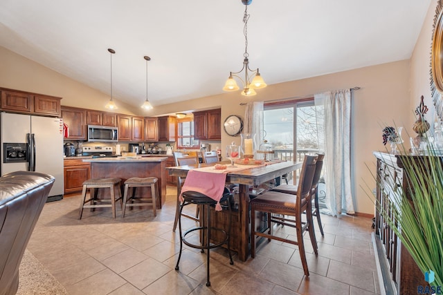2010 S Barret Pl, Sioux Falls, SD 57106 - dining space with a chandelier, light tile patterned flooring, and lofted ceiling