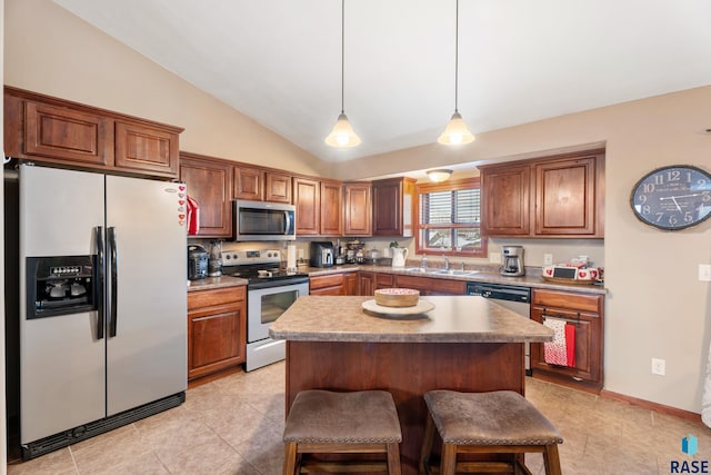 2010 S Barret Pl, Sioux Falls, SD 57106 - kitchen with light tile patterned floors, appliances with stainless steel finishes, a kitchen bar, a sink, and lofted ceiling