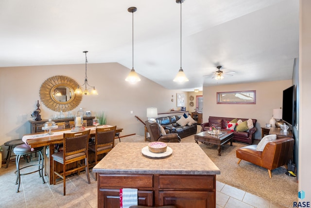 2010 S Barret Pl, Sioux Falls, SD 57106 - kitchen featuring lofted ceiling, light tile patterned floors, pendant lighting, light countertops, and open floor plan
