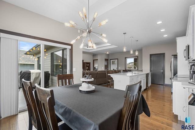 1917 S Firefly Dr, Sioux Falls, SD 57110 - dining space with recessed lighting, an inviting chandelier, and light wood-style flooring