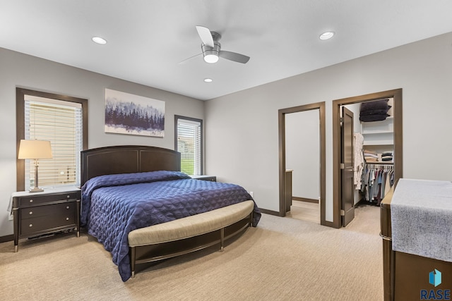 1917 S Firefly Dr, Sioux Falls, SD 57110 - bedroom with recessed lighting, a walk in closet, light carpet, and baseboards