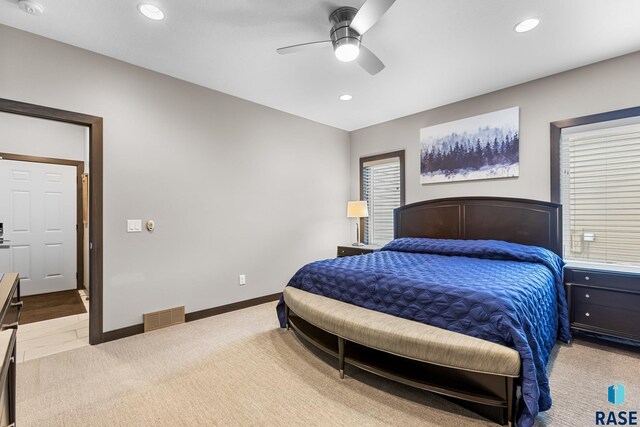 1917 S Firefly Dr, Sioux Falls, SD 57110 - bedroom with recessed lighting, a ceiling fan, visible vents, baseboards, and light colored carpet