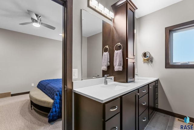 1917 S Firefly Dr, Sioux Falls, SD 57110 - bathroom with double vanity, ceiling fan, ensuite bathroom, a sink, and visible vents