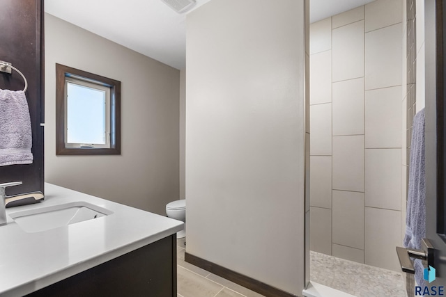 1917 S Firefly Dr, Sioux Falls, SD 57110 - full bathroom featuring visible vents, toilet, vanity, tile patterned flooring, and tiled shower