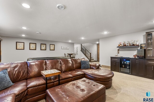 1917 S Firefly Dr, Sioux Falls, SD 57110 - living area featuring recessed lighting, stairway, wine cooler, wet bar, and light carpet