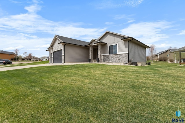1917 S Firefly Dr, Sioux Falls, SD 57110 - single story home with concrete driveway, board and batten siding, stone siding, a front lawn, and a garage