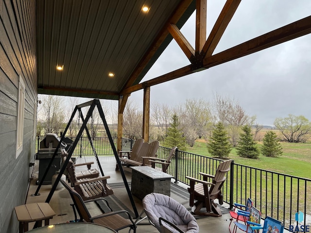 view of patio / terrace with a fire pit