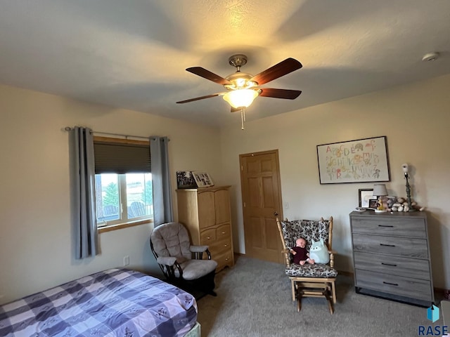 carpeted bedroom with ceiling fan
