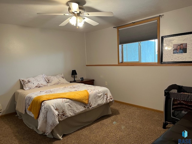 bedroom featuring carpet, a ceiling fan, and baseboards