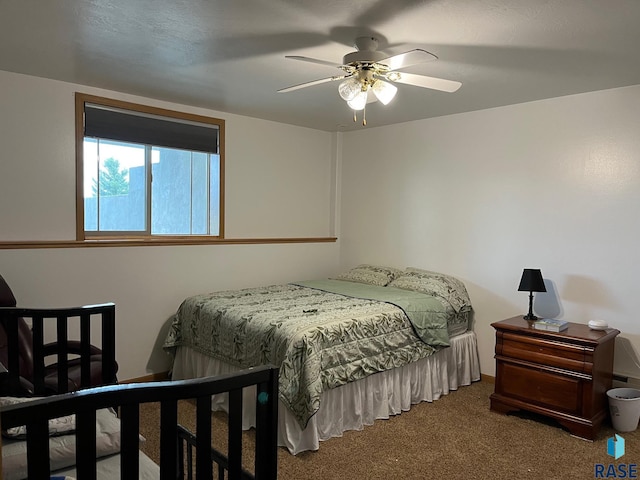 carpeted bedroom with a ceiling fan