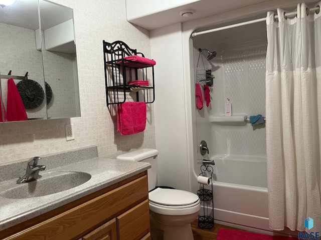 full bath featuring shower / bathtub combination with curtain, toilet, and vanity