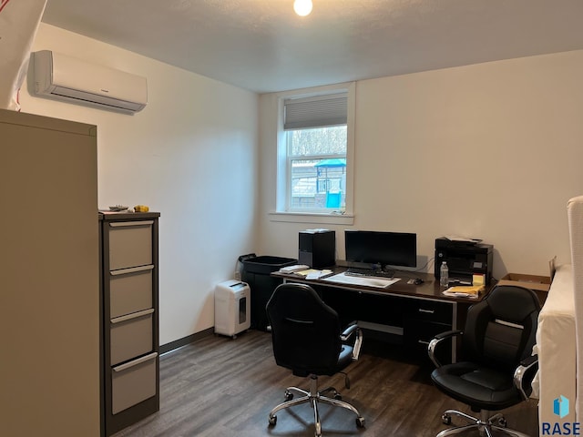 office space featuring a wall unit AC, wood finished floors, and baseboards