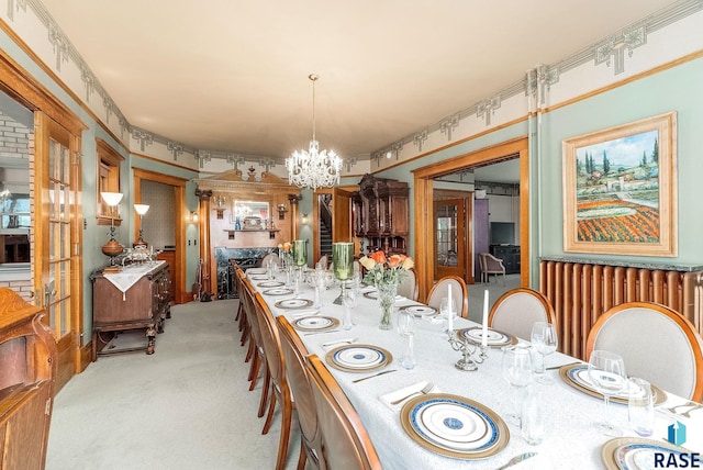 dining space with a notable chandelier and light carpet