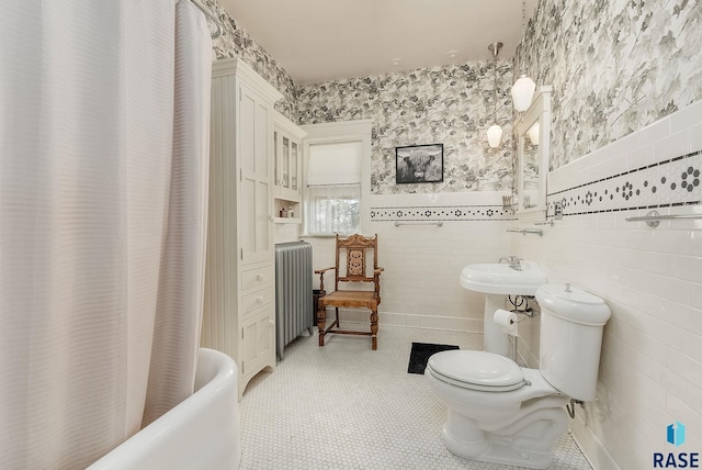 bathroom with shower / bathtub combination with curtain, toilet, tile walls, and radiator