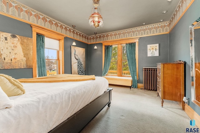 carpeted bedroom featuring baseboards and radiator heating unit