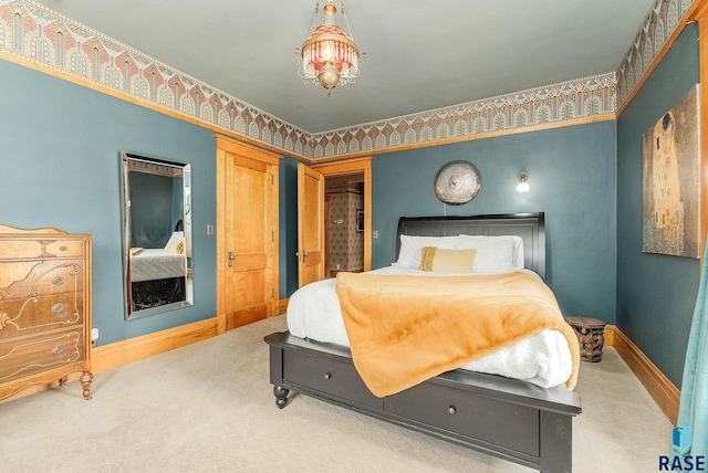 carpeted bedroom featuring baseboards