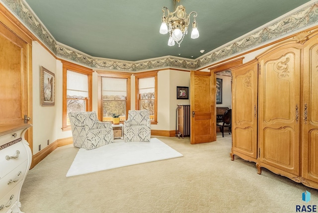 living area featuring a chandelier, baseboards, light carpet, and crown molding