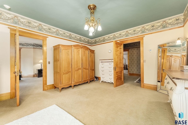unfurnished bedroom featuring ornamental molding, light colored carpet, and baseboards