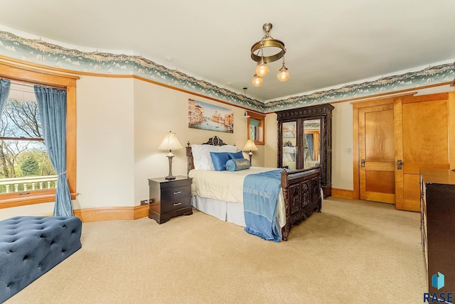 bedroom featuring light carpet and baseboards