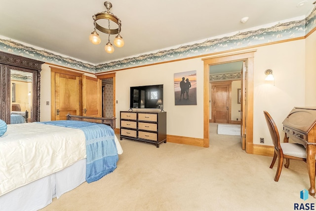 bedroom with baseboards and light colored carpet