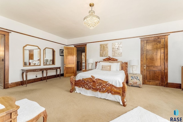 bedroom featuring a chandelier, baseboards, and light colored carpet