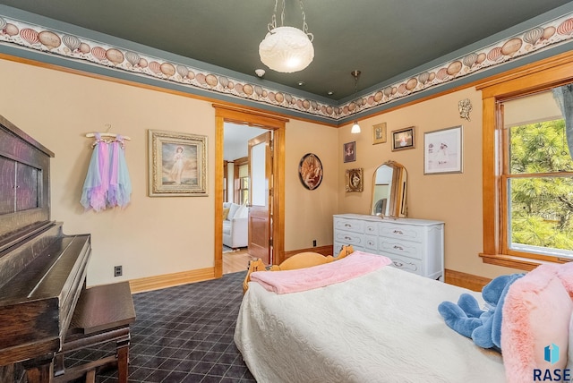 bedroom featuring baseboards and dark colored carpet