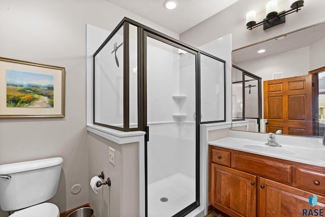full bath with toilet, visible vents, a shower stall, and vanity