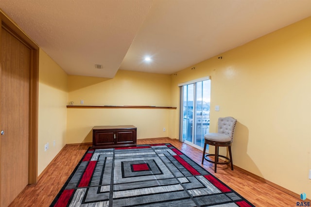 interior space with visible vents, wood finished floors, and recessed lighting