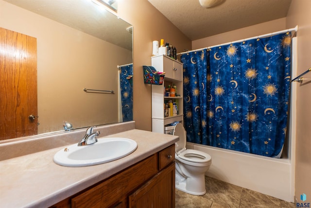 full bathroom featuring tile patterned floors, shower / bath combo, toilet, vanity, and a textured ceiling