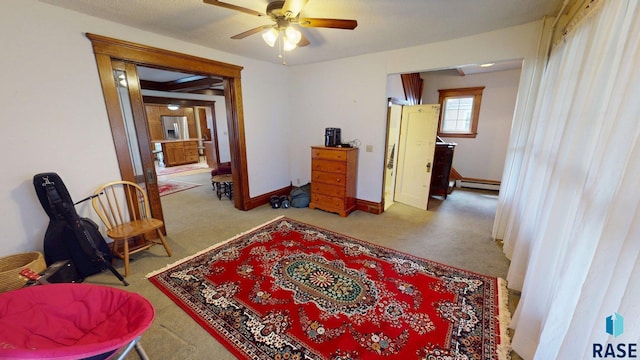 712 6th St, Brookings, SD 57006 - interior space with baseboard heating, baseboards, ceiling fan, and carpet