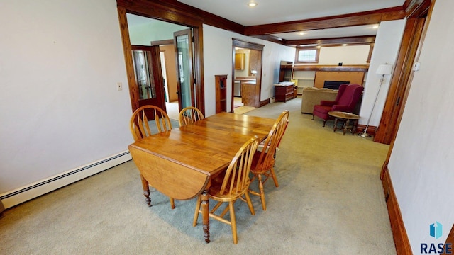 712 6th St, Brookings, SD 57006 - dining room featuring recessed lighting, beamed ceiling, baseboard heating, light carpet, and a fireplace