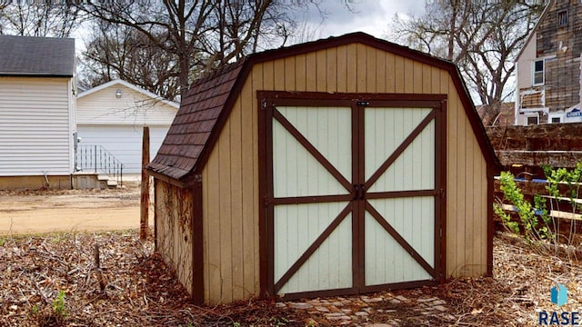 712 6th St, Brookings, SD 57006 - view of shed featuring fence