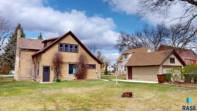 712 6th St, Brookings, SD 57006 - rear view of house with a lawn