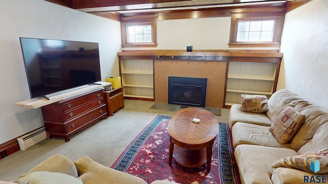 712 6th St, Brookings, SD 57006 - living area with a fireplace with flush hearth, light colored carpet, and a baseboard radiator