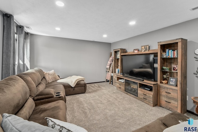 living area featuring recessed lighting, visible vents, carpet, and baseboards