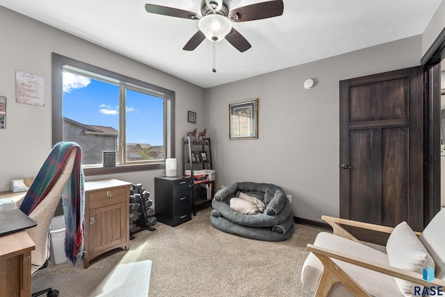 home office with light carpet and ceiling fan