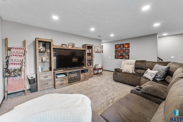 living room featuring recessed lighting, carpet flooring, and stairway